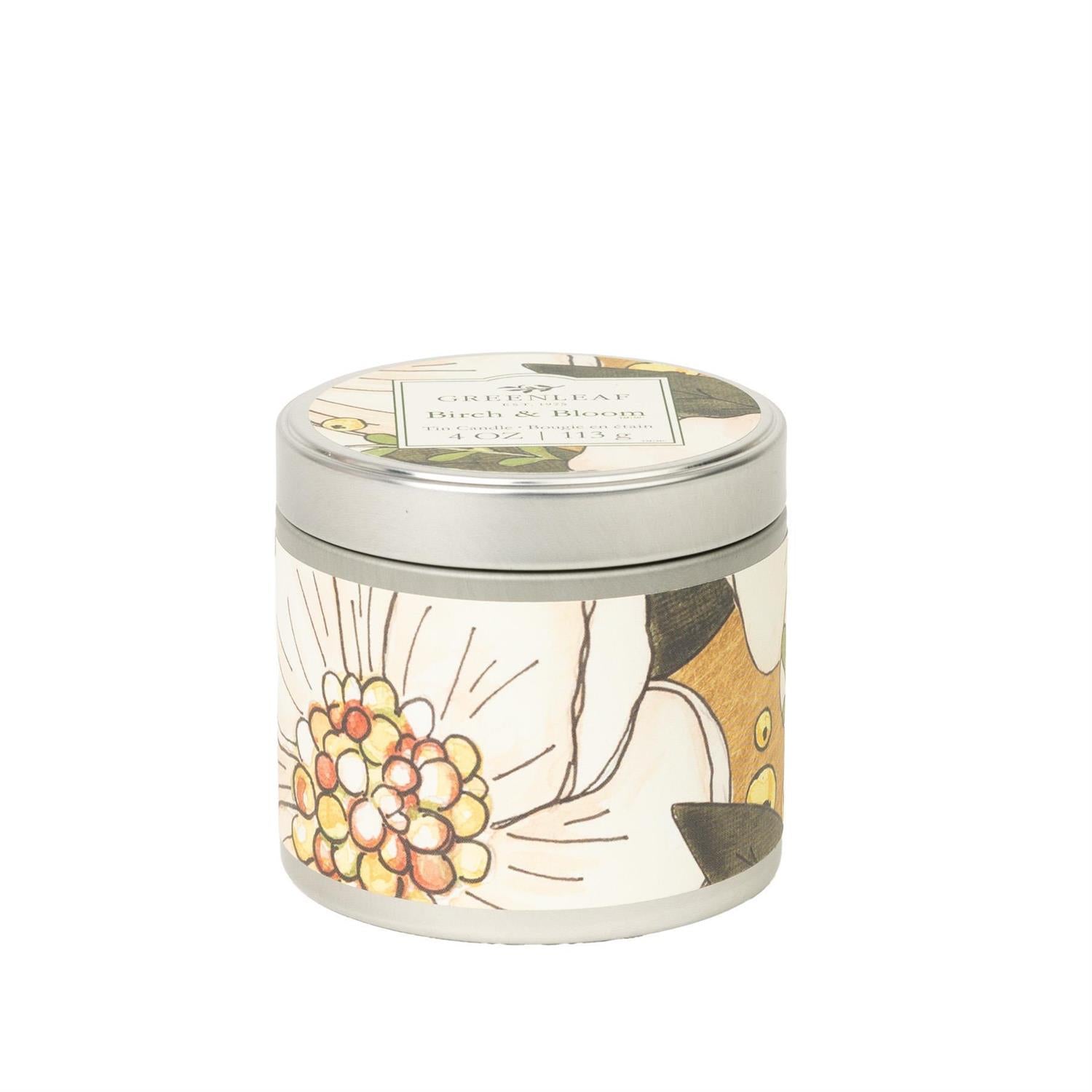 Candle tin with floral design on a white background