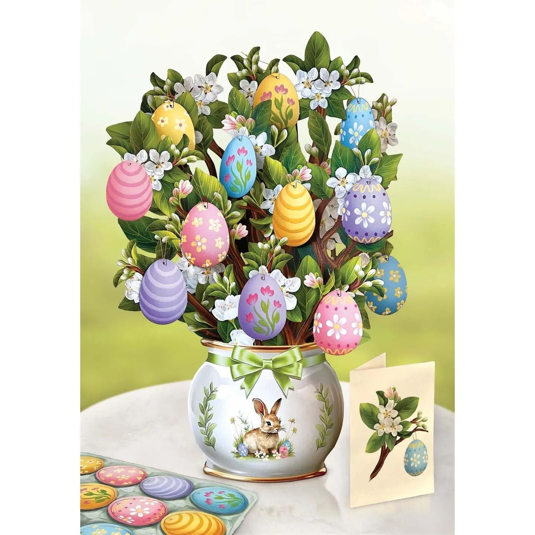 Pop Up 3D Greeting Card Tree Decorated with Easter Colorful Eggs in a white Bunny Vase, with a green background.