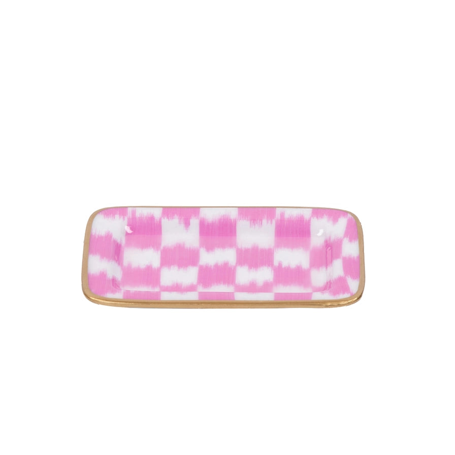 Checkered trinket tray with pink and white pattern on a white background