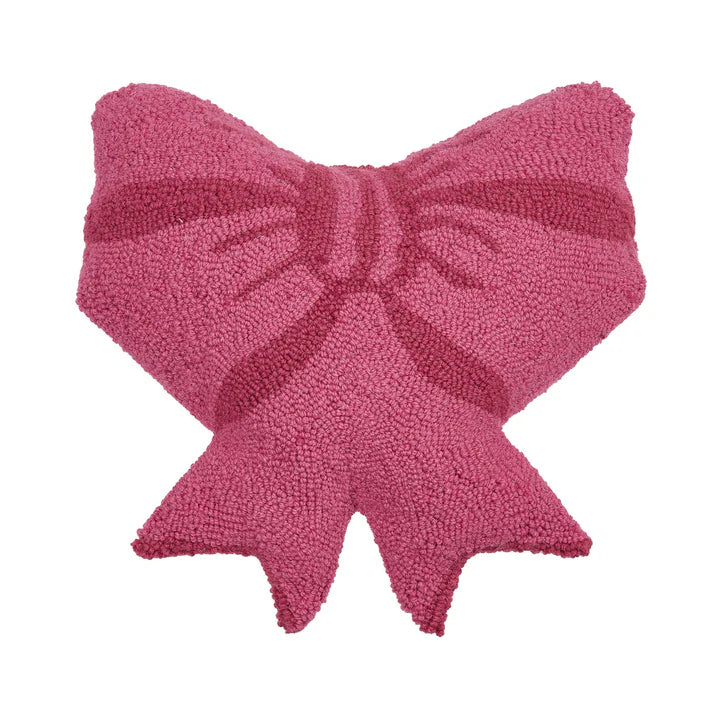 Pink bow-shaped pillow on a white background