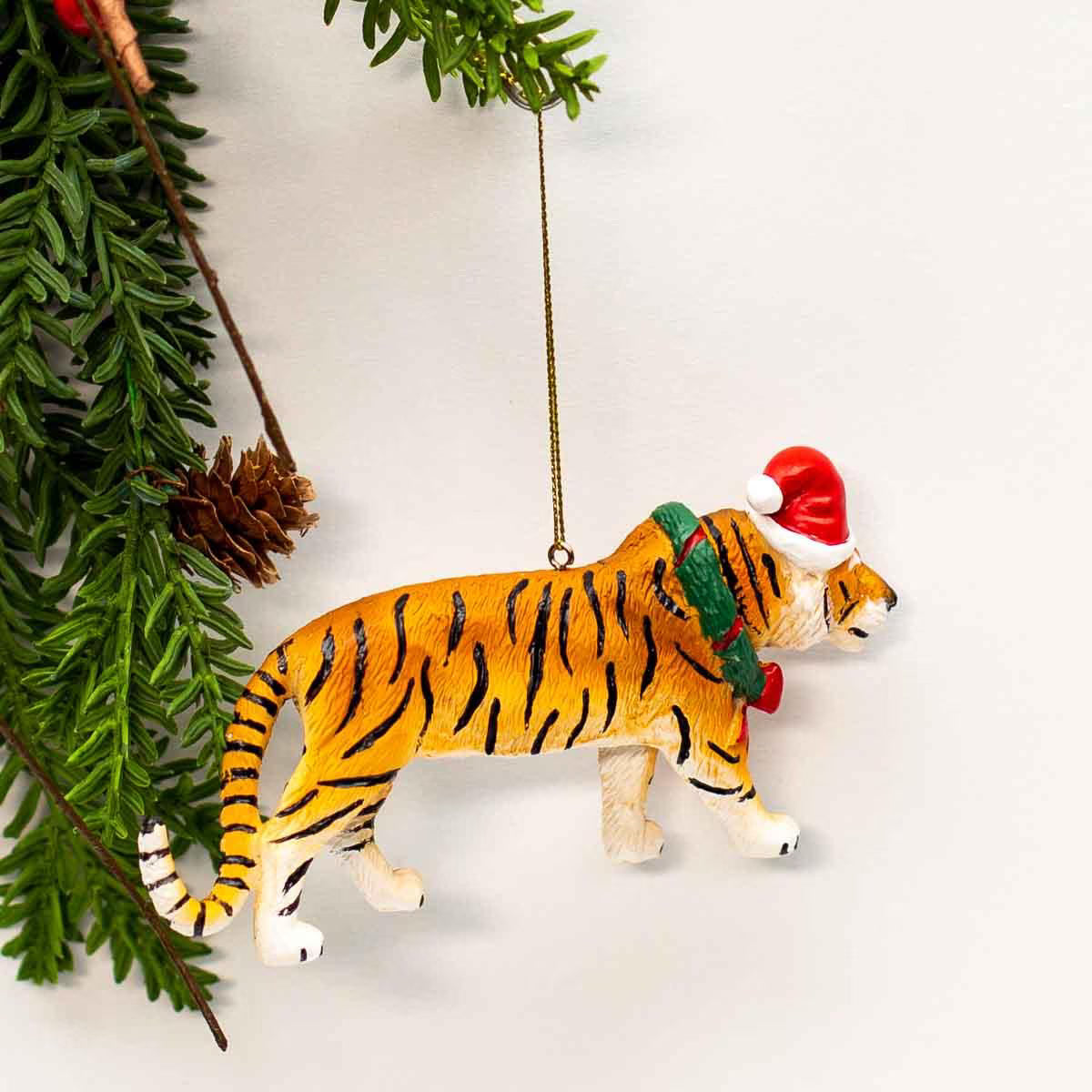 tiger ornament hanging on tree branch 