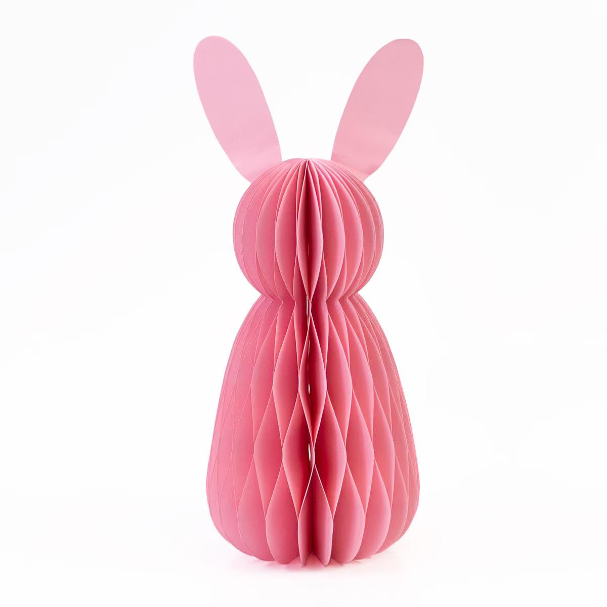 Pink paper bunny sculpture on a white background