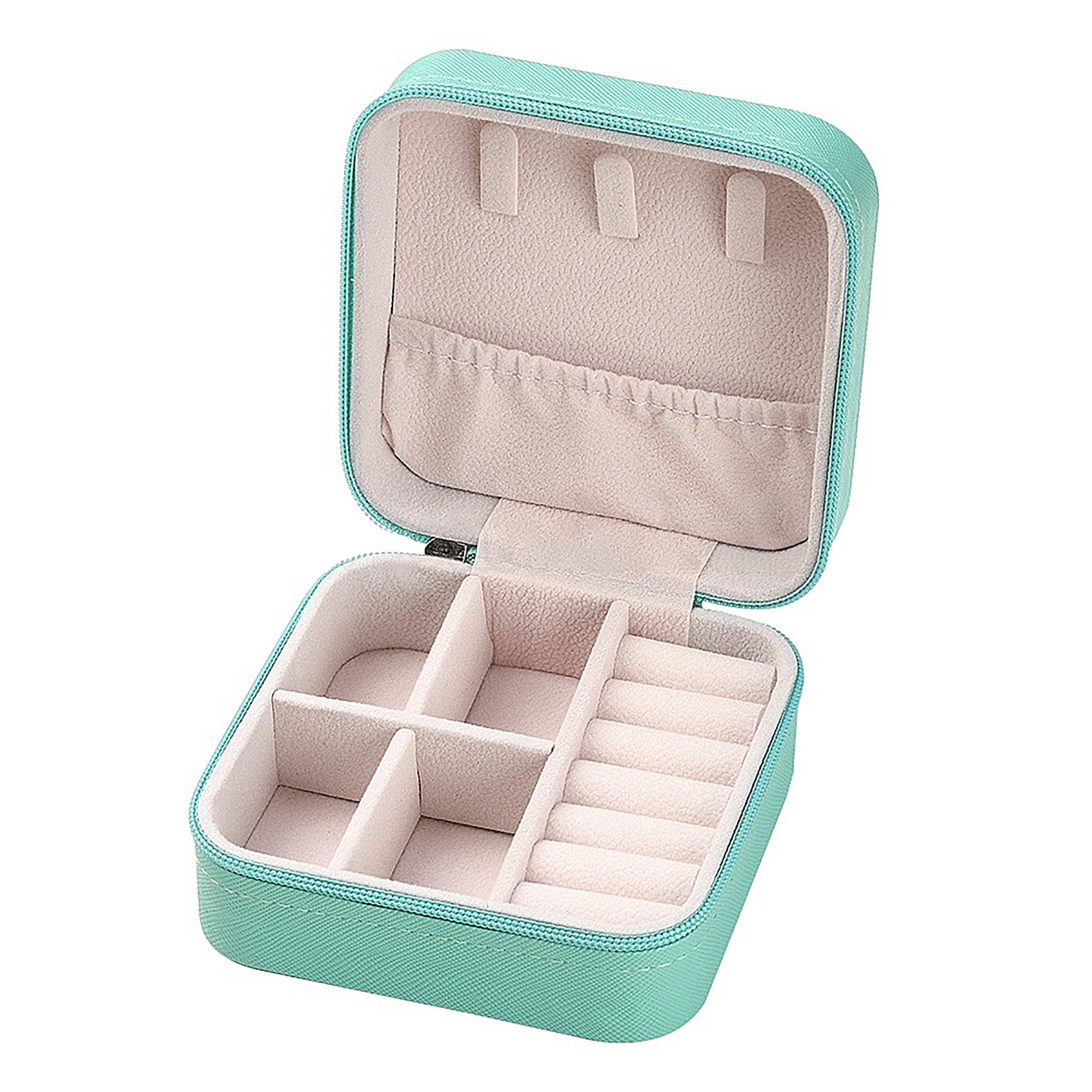 Toss Designs Brand Open turquoise jewelry box with beige interior on a white background