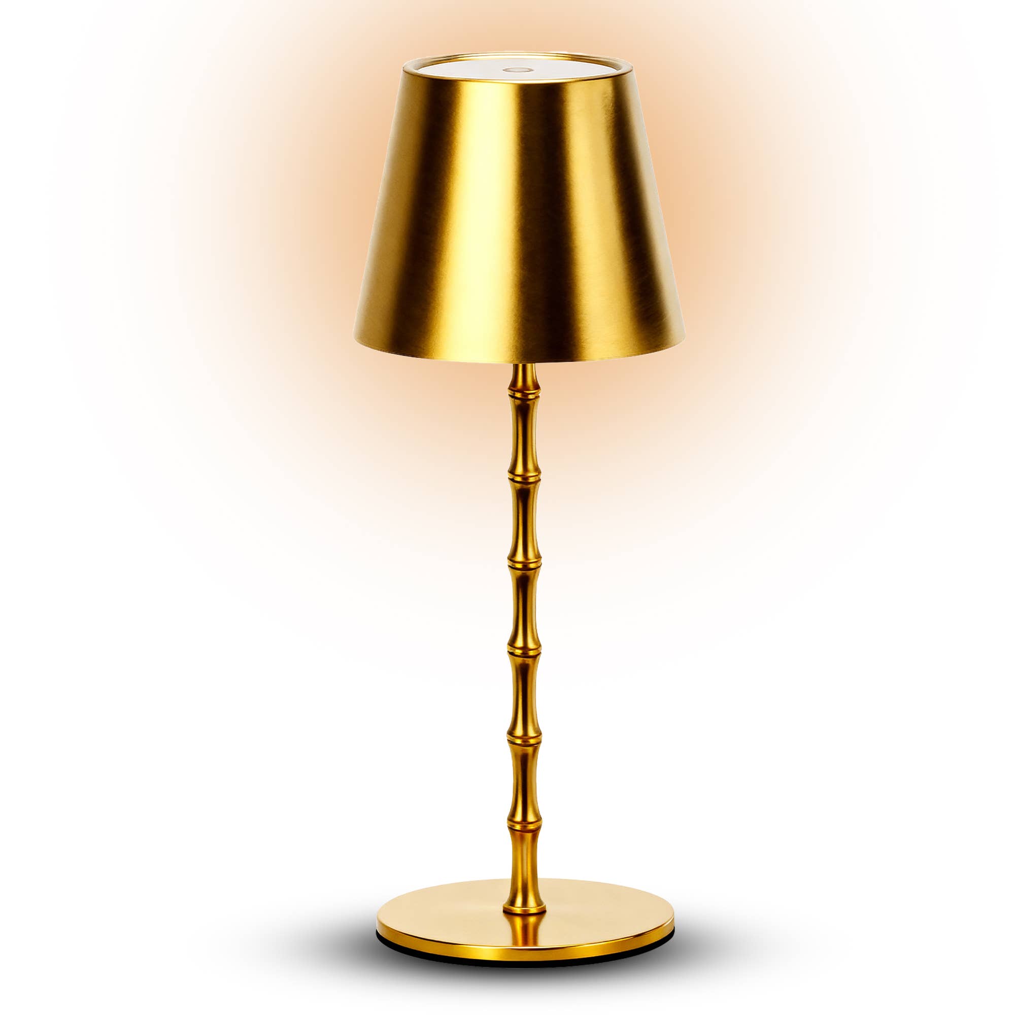 Gold table lamp with a bamboo-style base on a white background