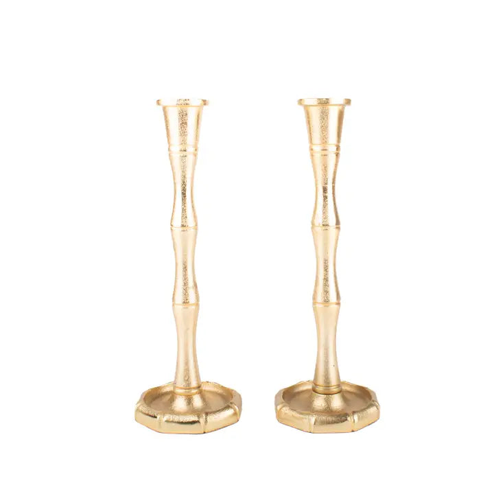 Two 8 Oak Lane Brand gold bamboo shaped candle holders on a white background