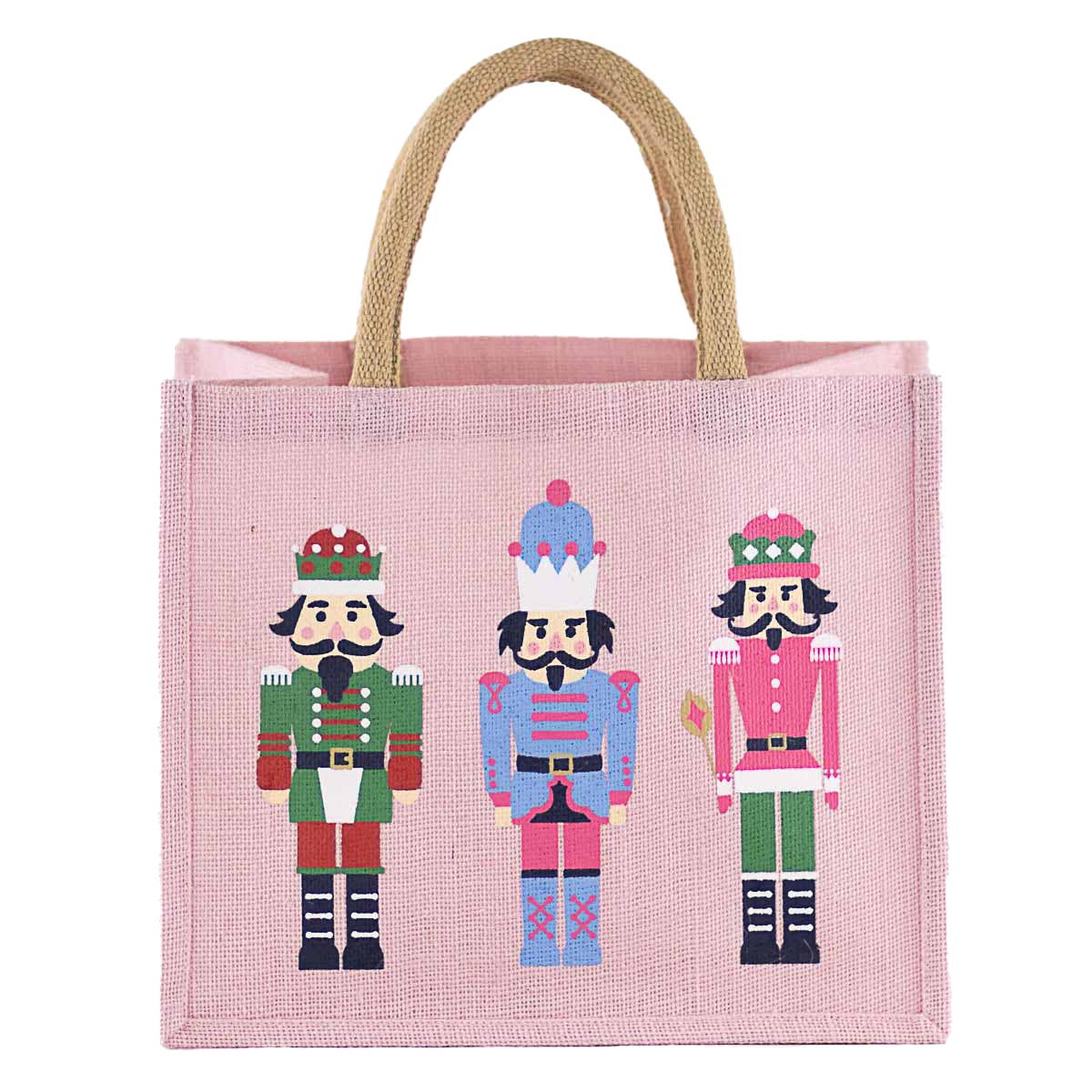 A pink jute tote bag with two natural jute handles, featuring a graphic print of three colorful nutcracker soldiers on the front, set against a plain white background.