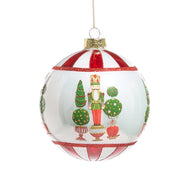 Ball ornament with nutcracker and topiary