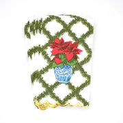 Decorative card with poinsettias and a blue pot on a white background