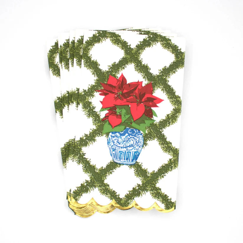 Decorative card with poinsettias and a blue pot on a white background