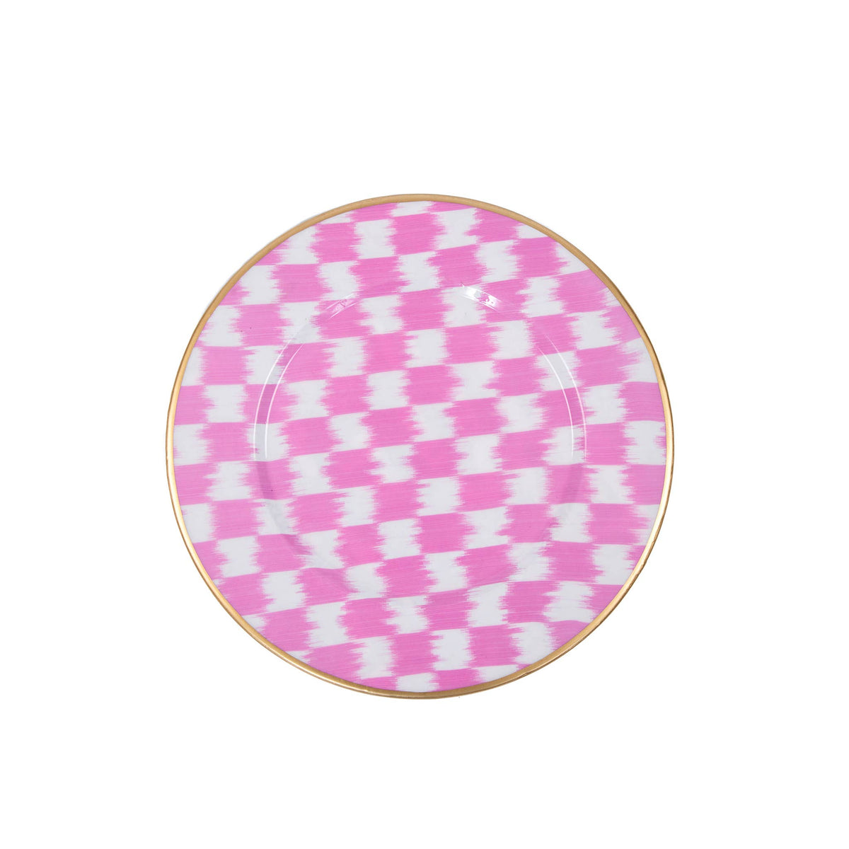 A round Jaye's studio charger featuring a pink and white ikat pattern and a thin gold rim, shown from a top-down view on a white background.