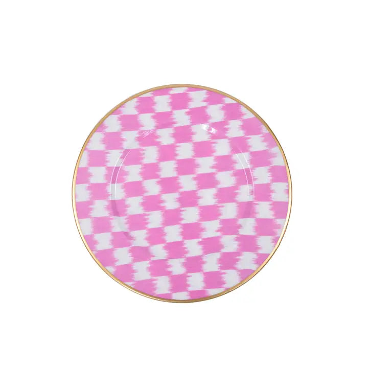 Round plate with pink and white checkered pattern on a white background