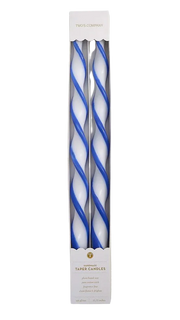 Two blue and white twisted candles in a packaging box on a white background