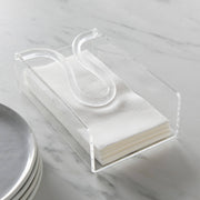 Huang Acrylic Brand Clear acrylic guest size napkin holder with white napkins on a marble surface