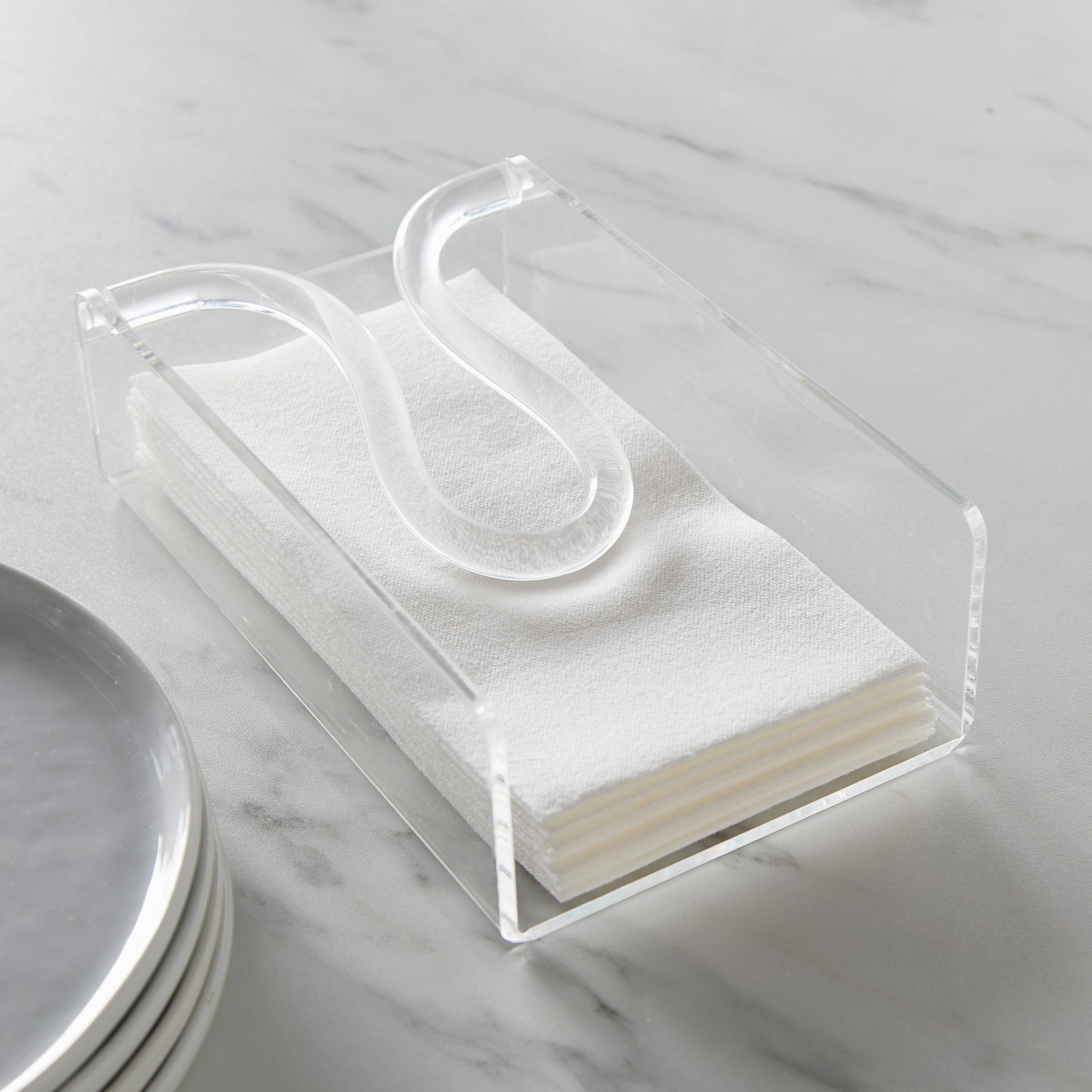 Huang Acrylic Brand Clear acrylic guest size napkin holder with white napkins on a marble surface