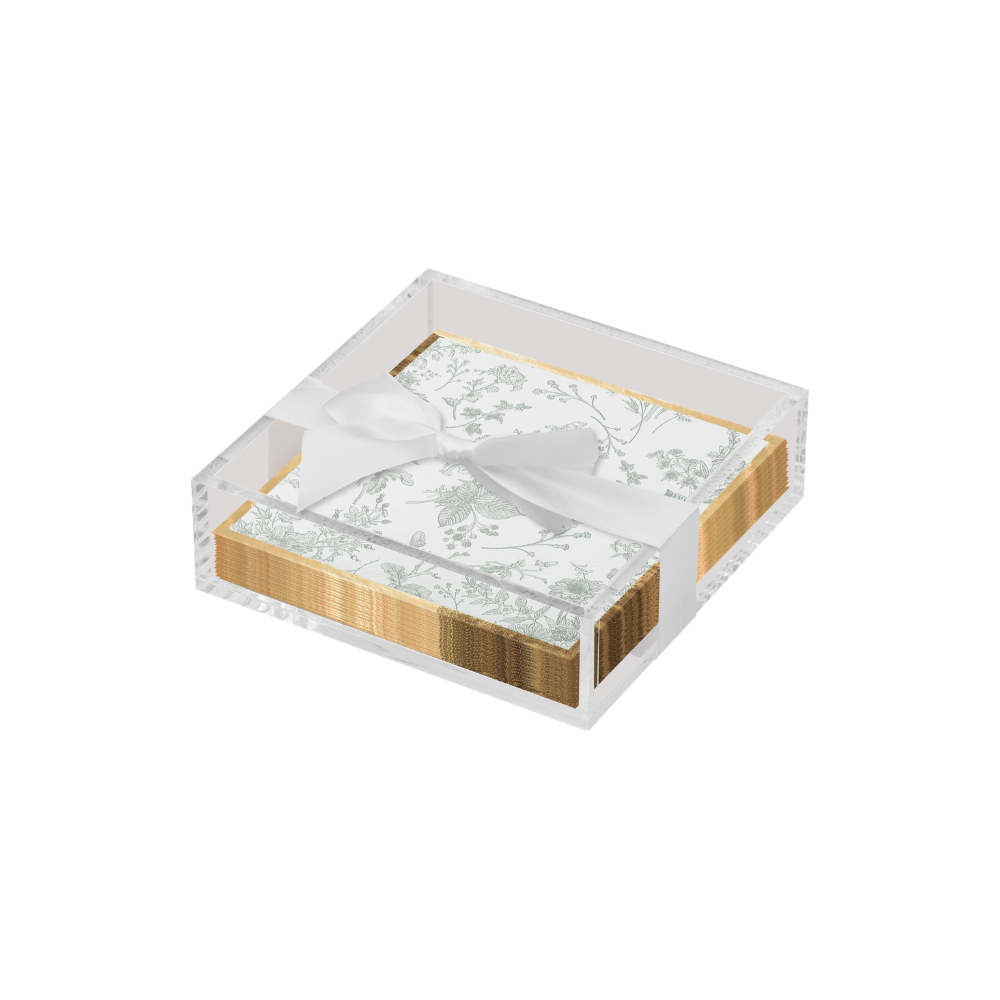 Set of  paper cocktail napkins with sage design and gold patterns in a decorative box on a white background