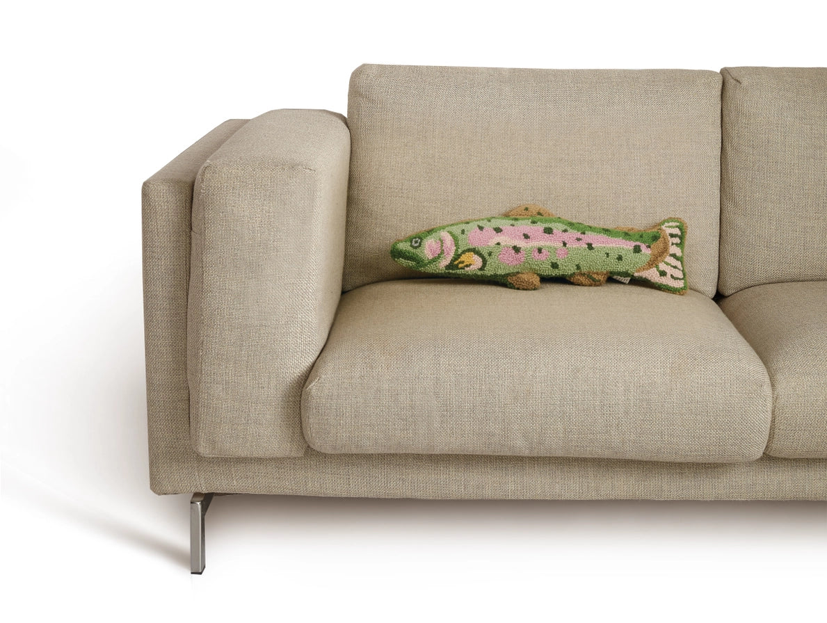 Beige sofa with a decorative fish-shaped pillow on a white background