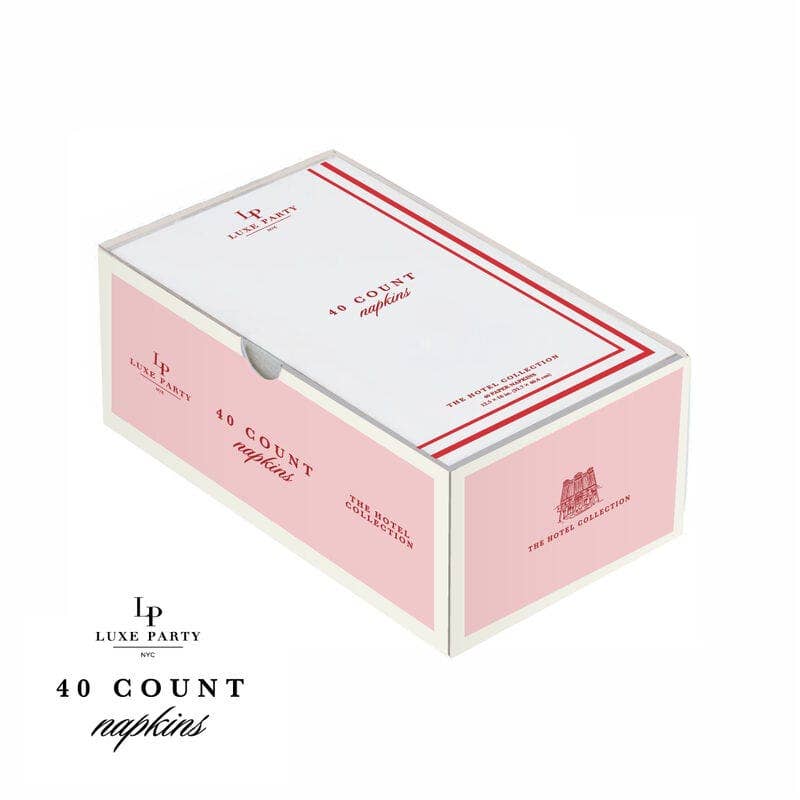 Pink box of Luxe Party napkins with red accents on a white background