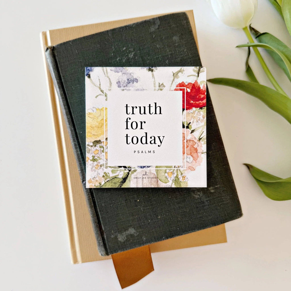 Stack of cards titled 'truth for today Psalms' with floral design on a white surface