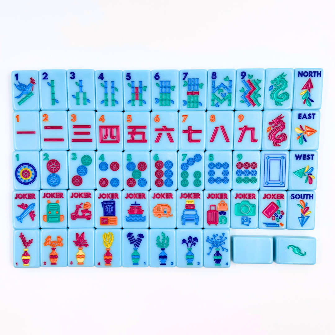 Set of colorful Mahjong game tiles with various symbols on a white background