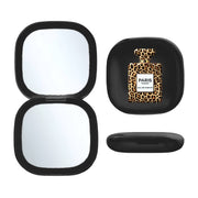 Toss Designs Brand Black compact mirror with leopard print perfume bottle design on a white background