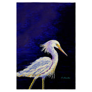 Painting of a white heron on a dark blue background on a tea towel