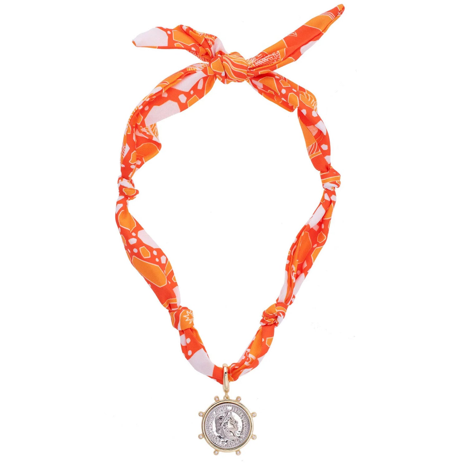 Orange and white patterned headband with a decorative pendant on a white background