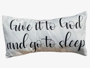 Decorative pillow with text 'Give it to God and go to sleep' on a white background