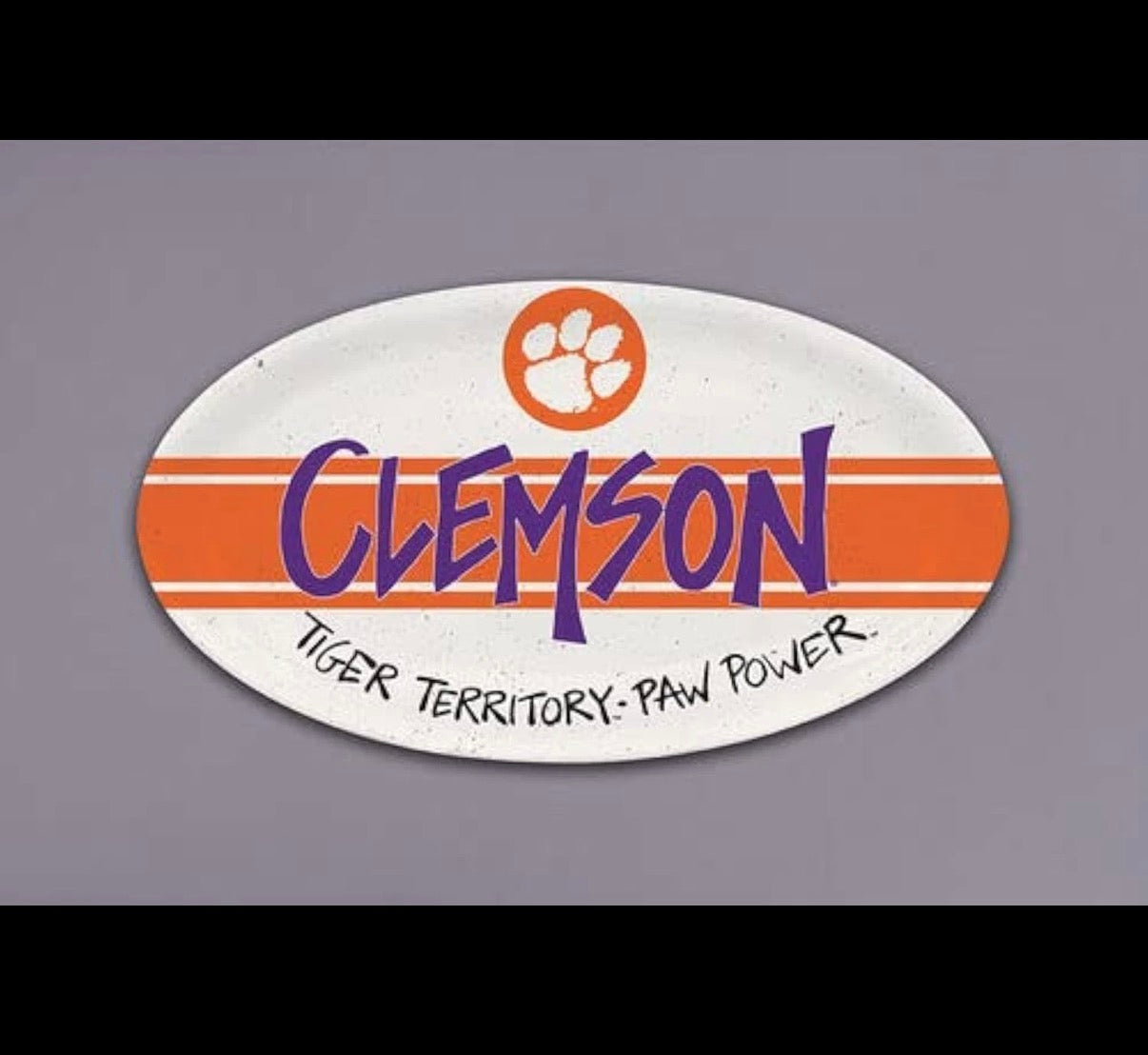 Oval-shaped melamine plastic platter with 'Clemson' text and paw print logo on a gray background