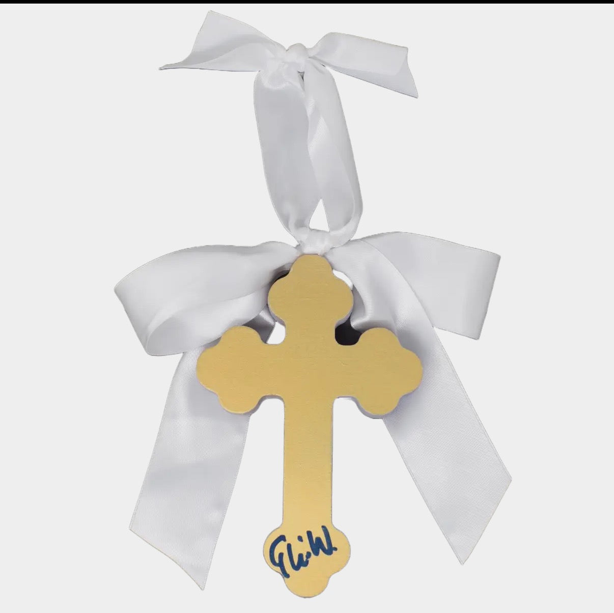 Gold cross with white ribbon on a white background