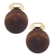 Pair of wooden ball earrings with gold tops on a white background