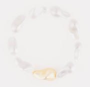 Gold white beaded bracelet on a white background