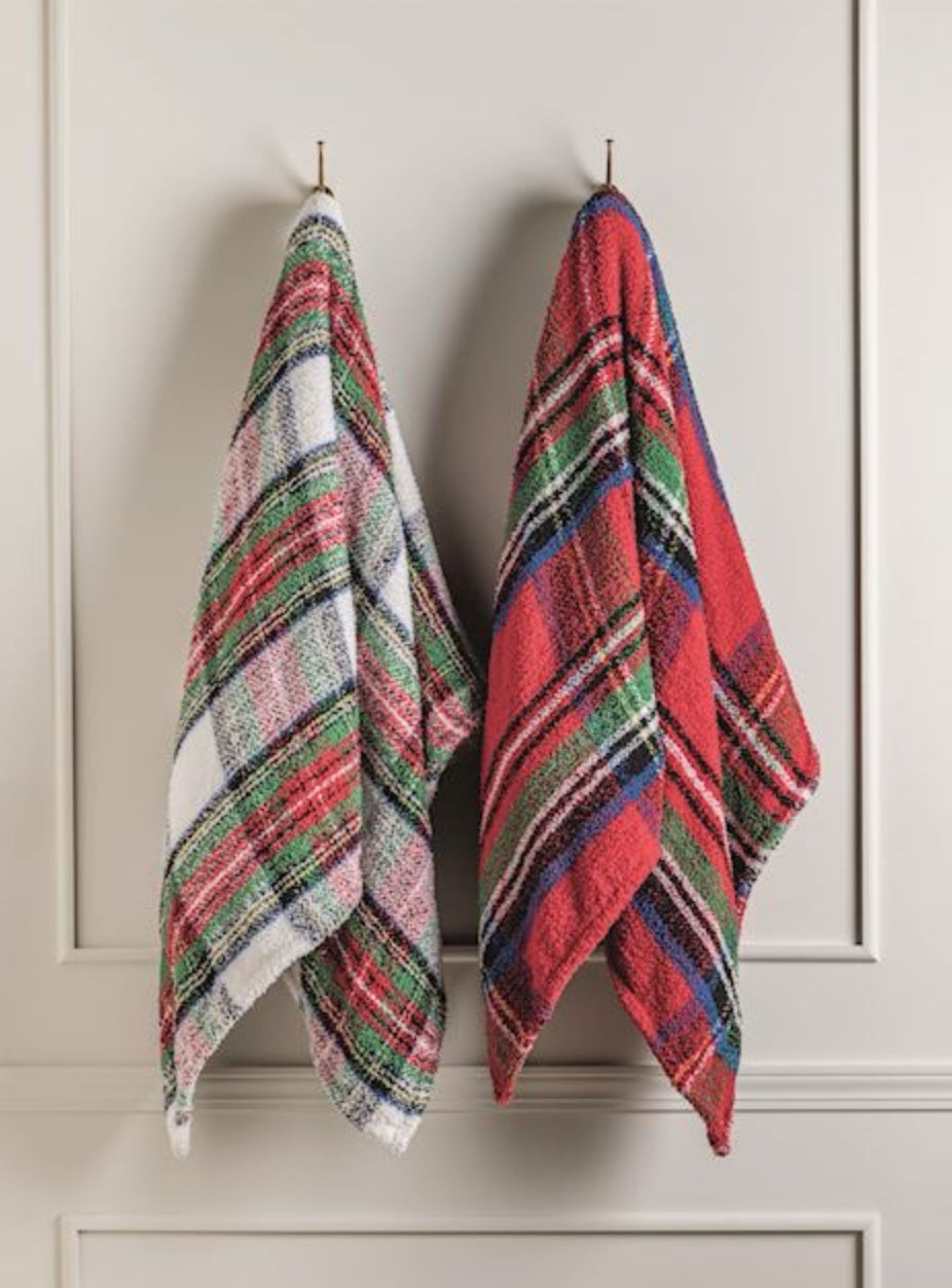 Picture 2 - two plaid blankets hanging on hooks on a wall 