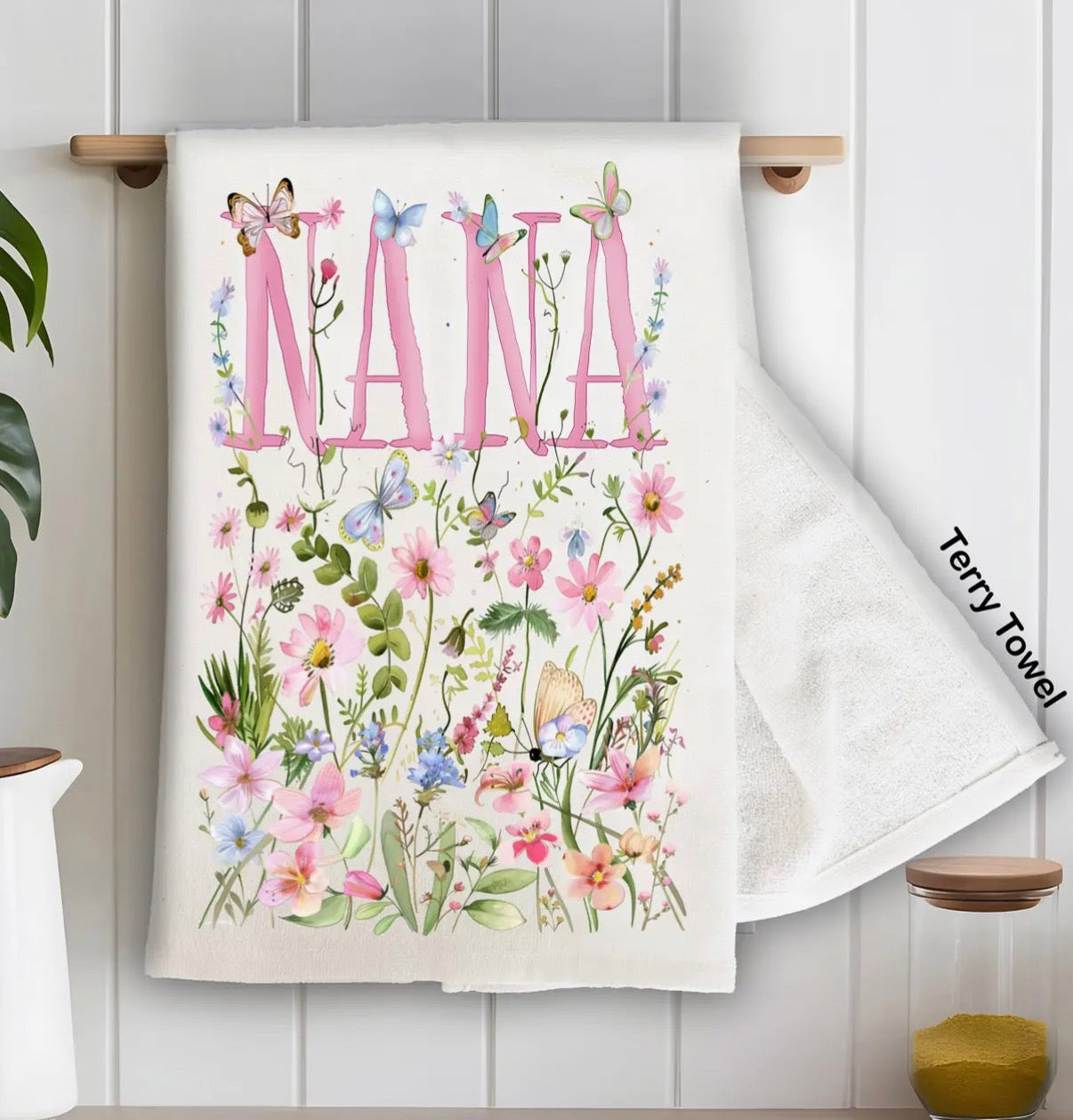 Terry towel with floral design and 'Nana' text on a white background