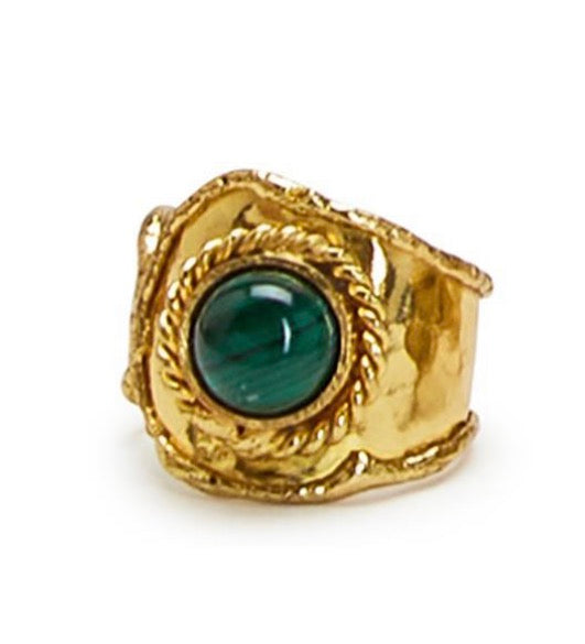 Gold ring with a green gemstone on a white background