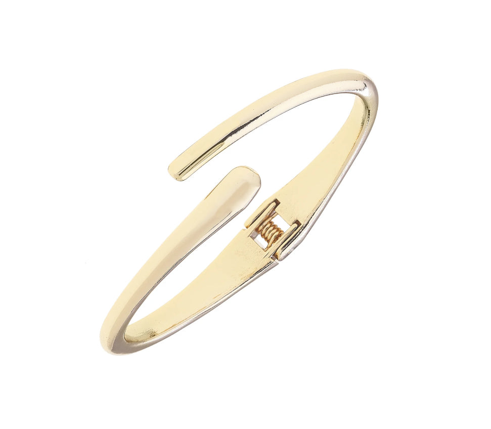 Gold bangle on a white background