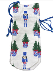 Drawstring bag with Christmas-themed design featuring trees and nutcrackers on a white background.