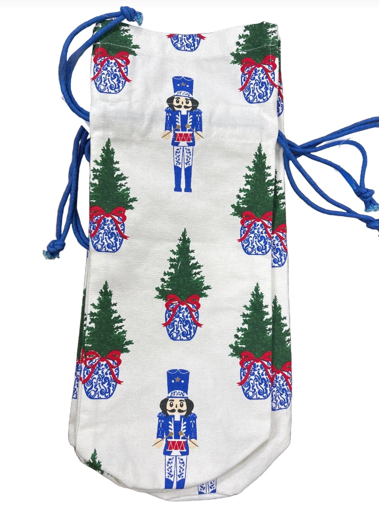 Drawstring bag with Christmas-themed design featuring trees and nutcrackers on a white background.