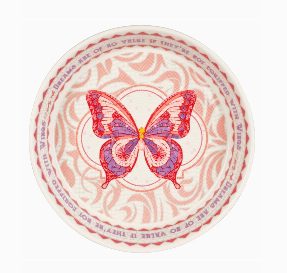 Round coaster with a butterfly design and text on a white background