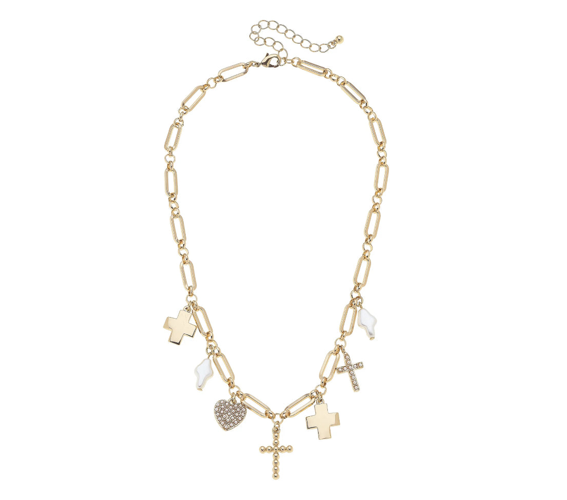 Gold necklace with various charms on a white background