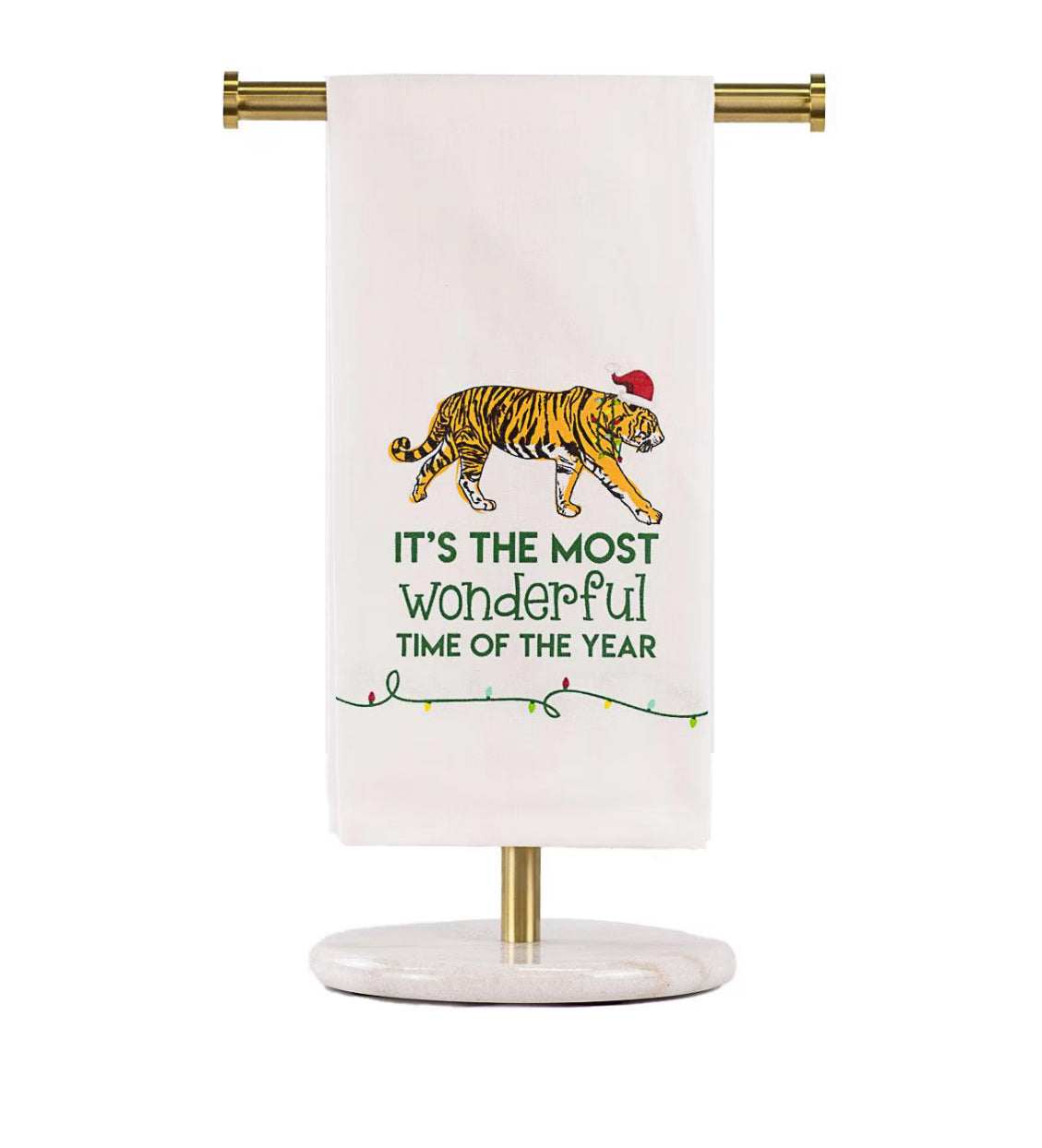 Towel with a tiger design and text on a stand