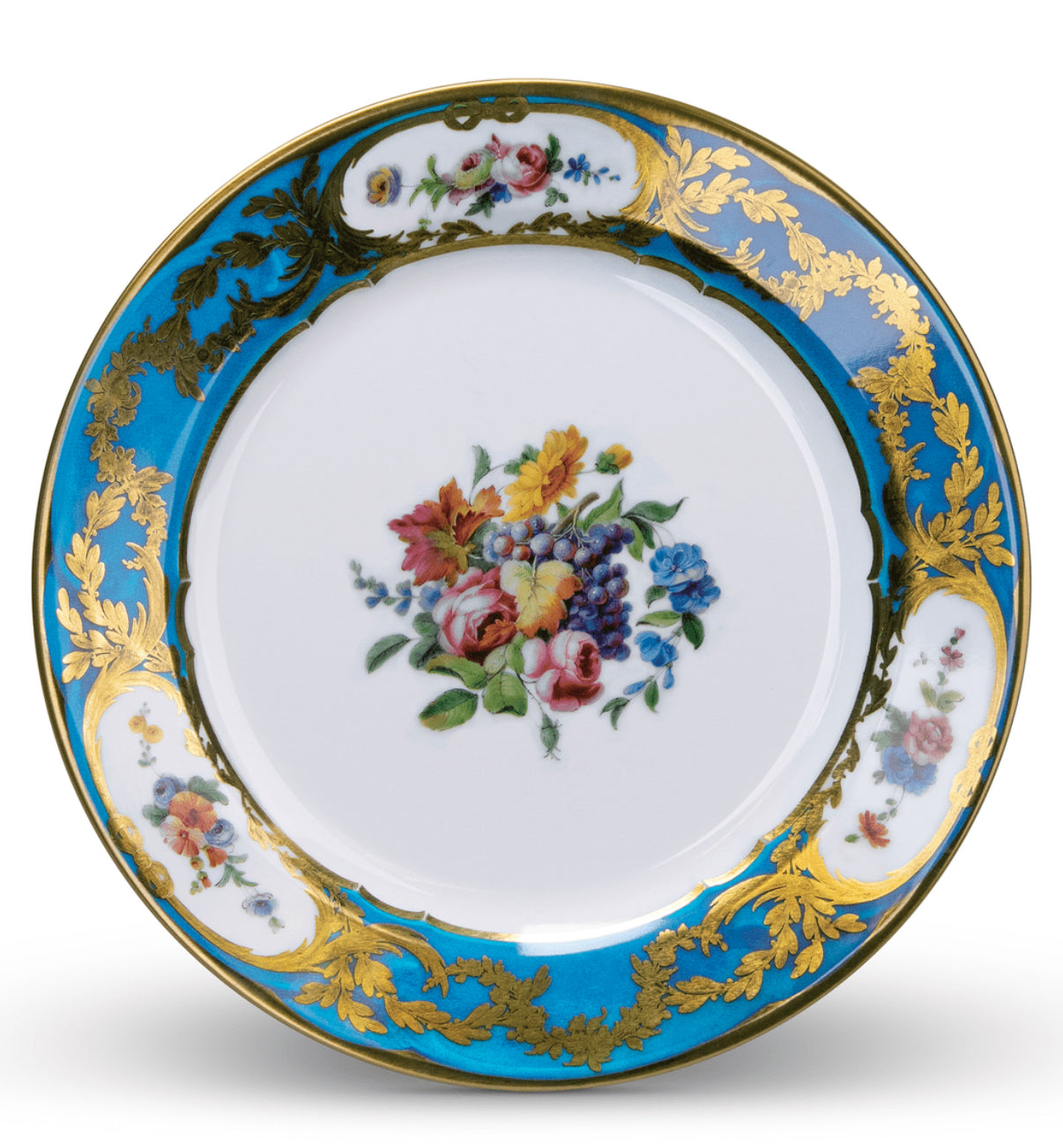 A decorative tin plate with a central floral motif, surrounded by blue and gold patterns.