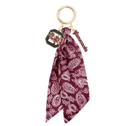 Maroon bandana with white paisley pattern keychain on a white background