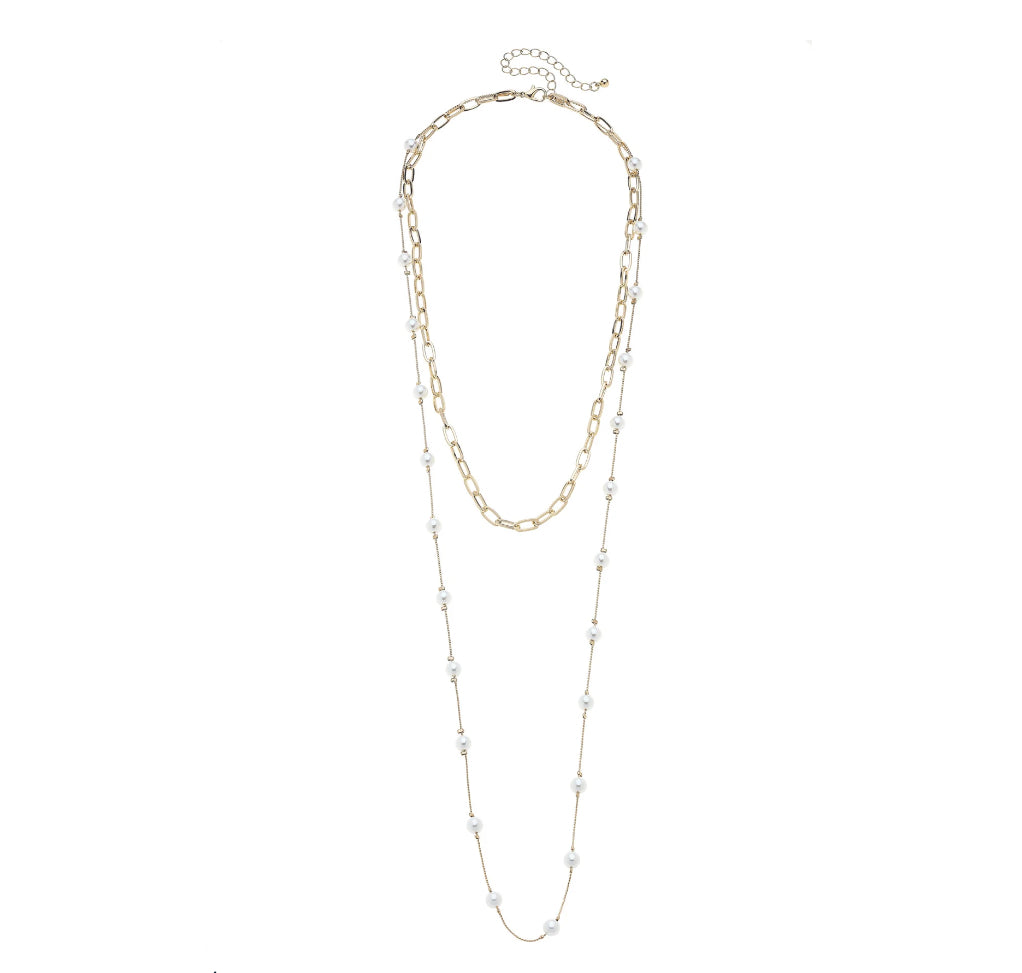 Two-layered necklace with gold and silver chains on a white background