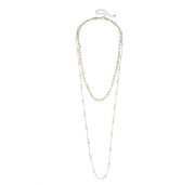 Two-layered necklace with gold and silver chains on a white background