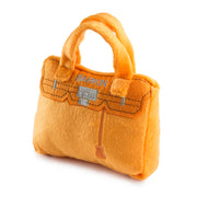 Orange handbag-shaped toy with 'Barkin' branding on a white background
