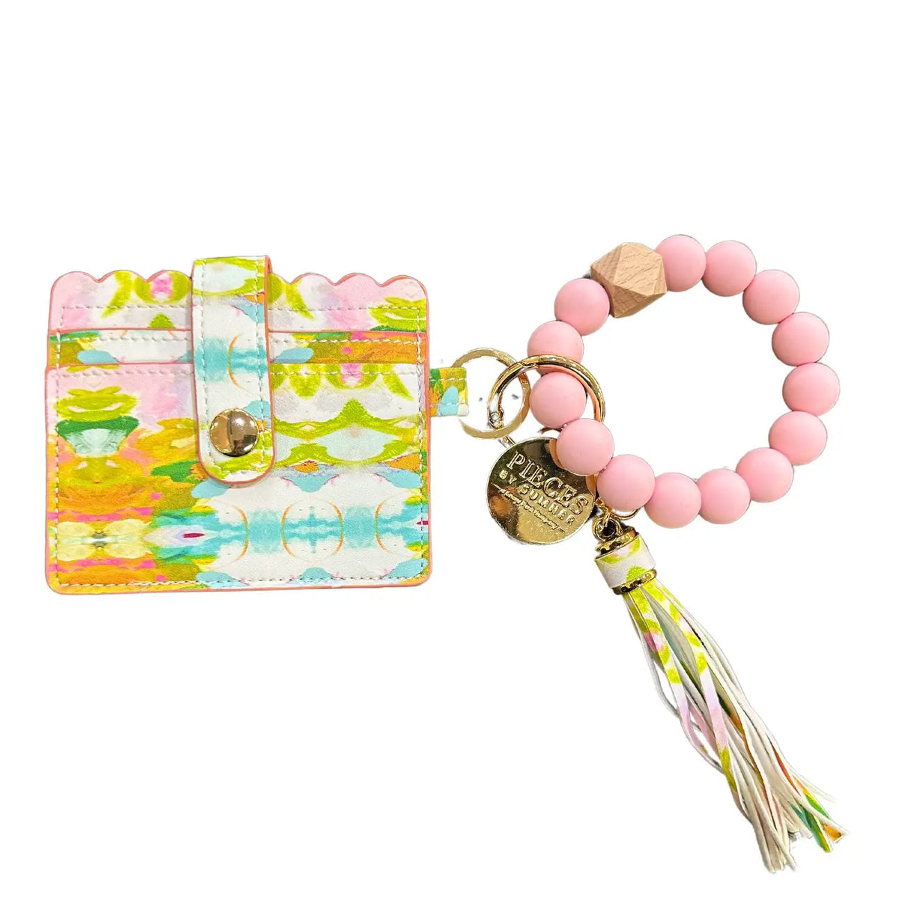 Colorful keychain with pink beaded bracelet and tassel on a white background