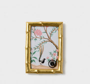 Decorative box with floral and bird design on a white background