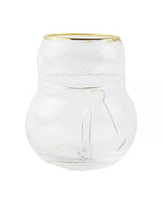 Clear glass vase with gold rim on a white background