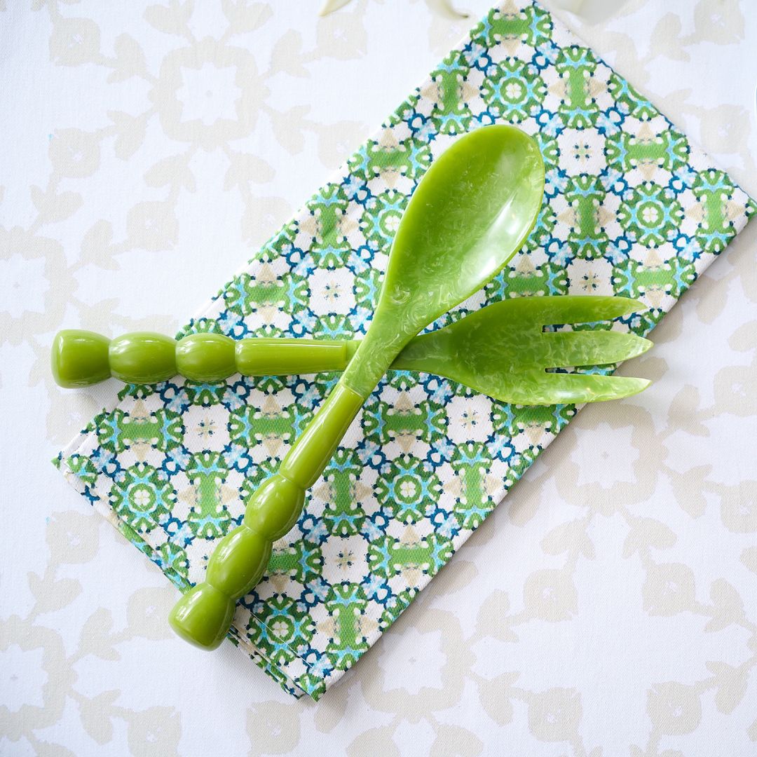 Green melamine spoon and ladle set on a Serendipity Tea Towel 