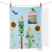 Tea Towel - Birdhouse Lane- picture is of a baby blue tea towel and design is of sunflowers and bird houses and a bird, the towel is hanging on a clothes line